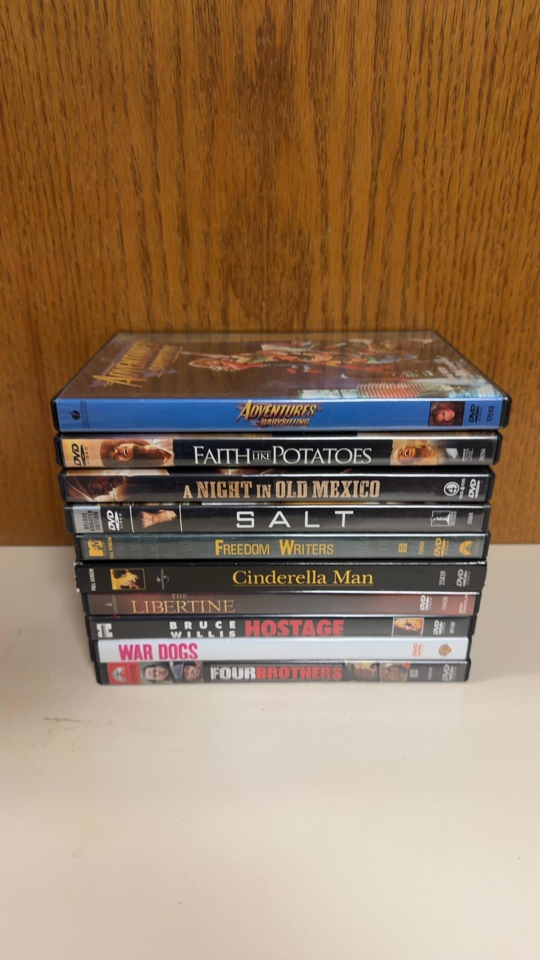 Lot of 10 DVD Movies (Adventures in Babysitting, Salt, War Dogs, Four Brothers, etc.) - Image 1