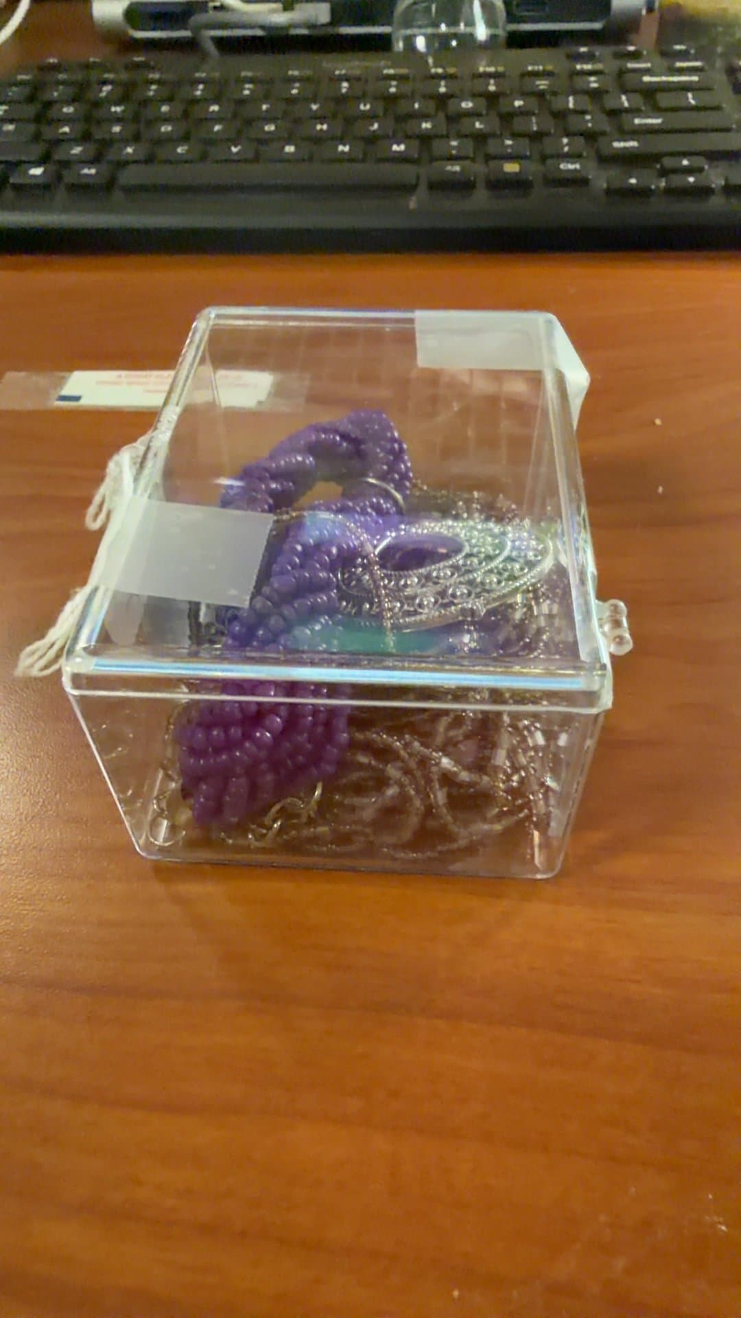 Clear Plastic Jewelry Box with Beaded Necklaces - Image 1