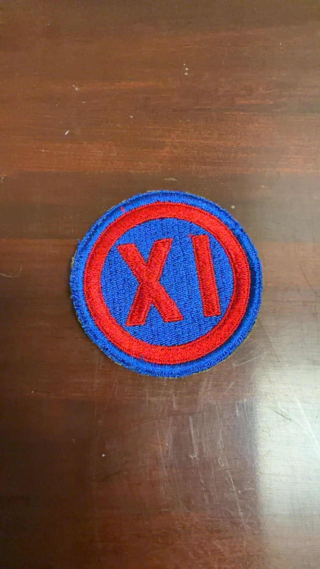 Embroidered Patch with 'XI' Design - Image 1