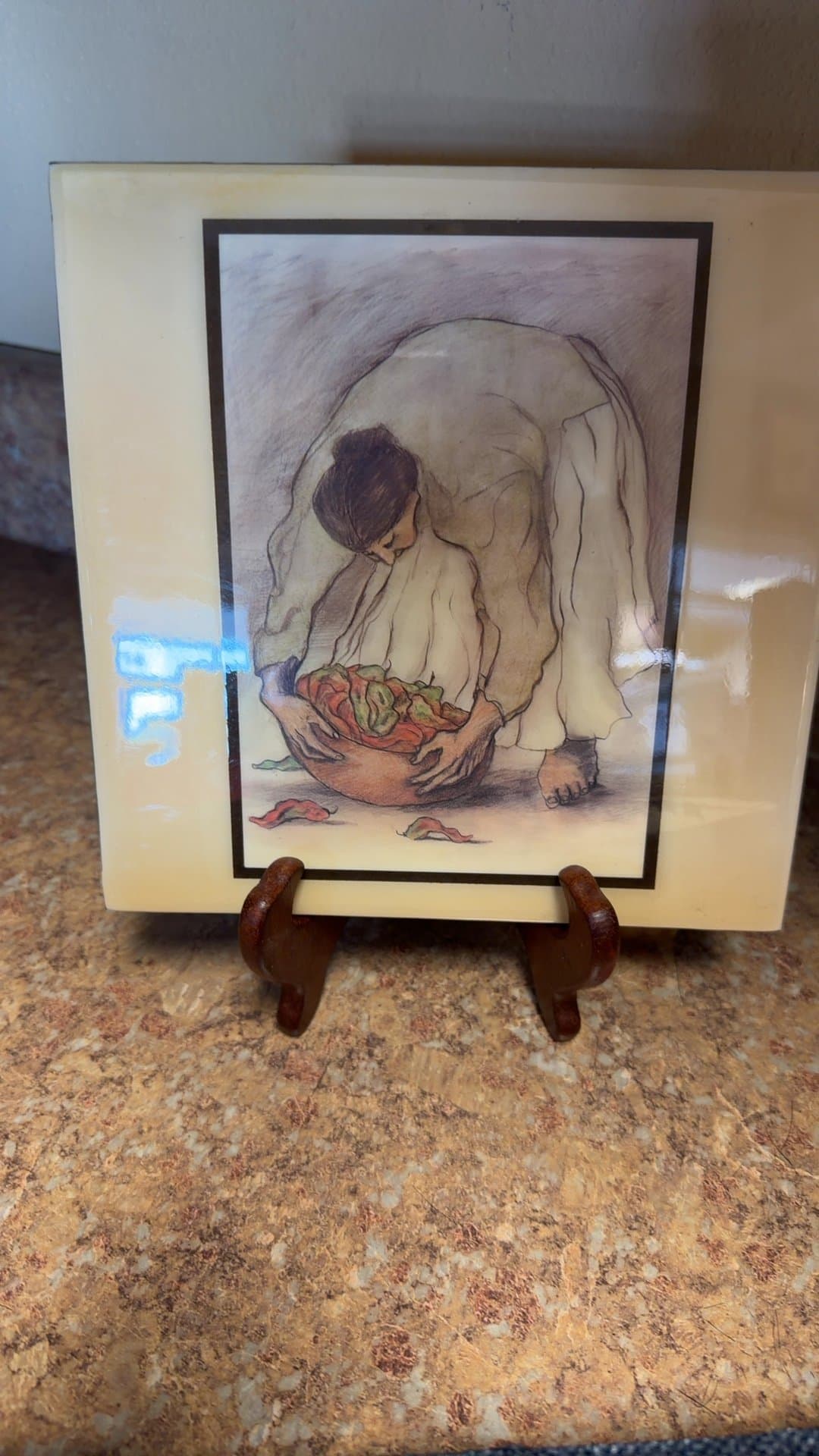 Framed Artwork of Person with Bowl - Image 1