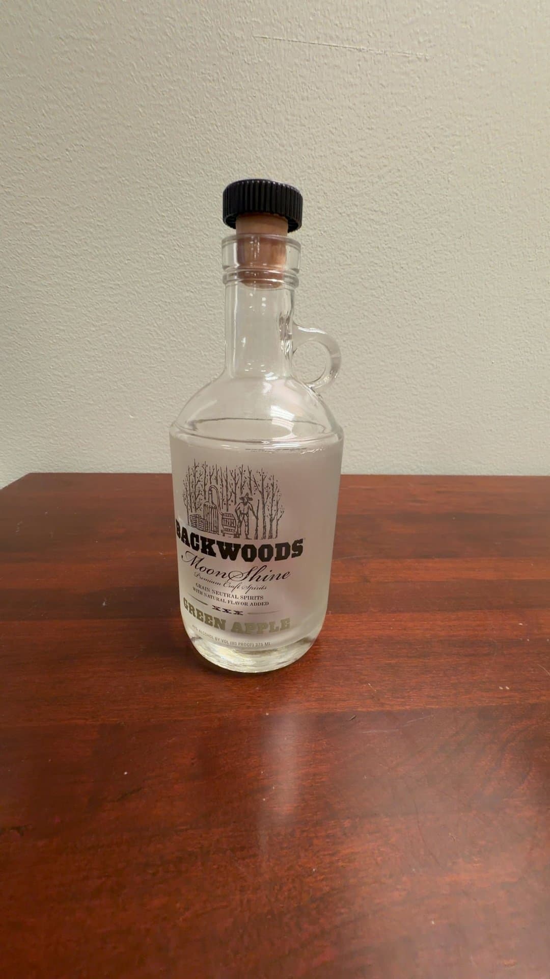 Backwoods Moonshine Green Apple Glass Bottle - Image 1
