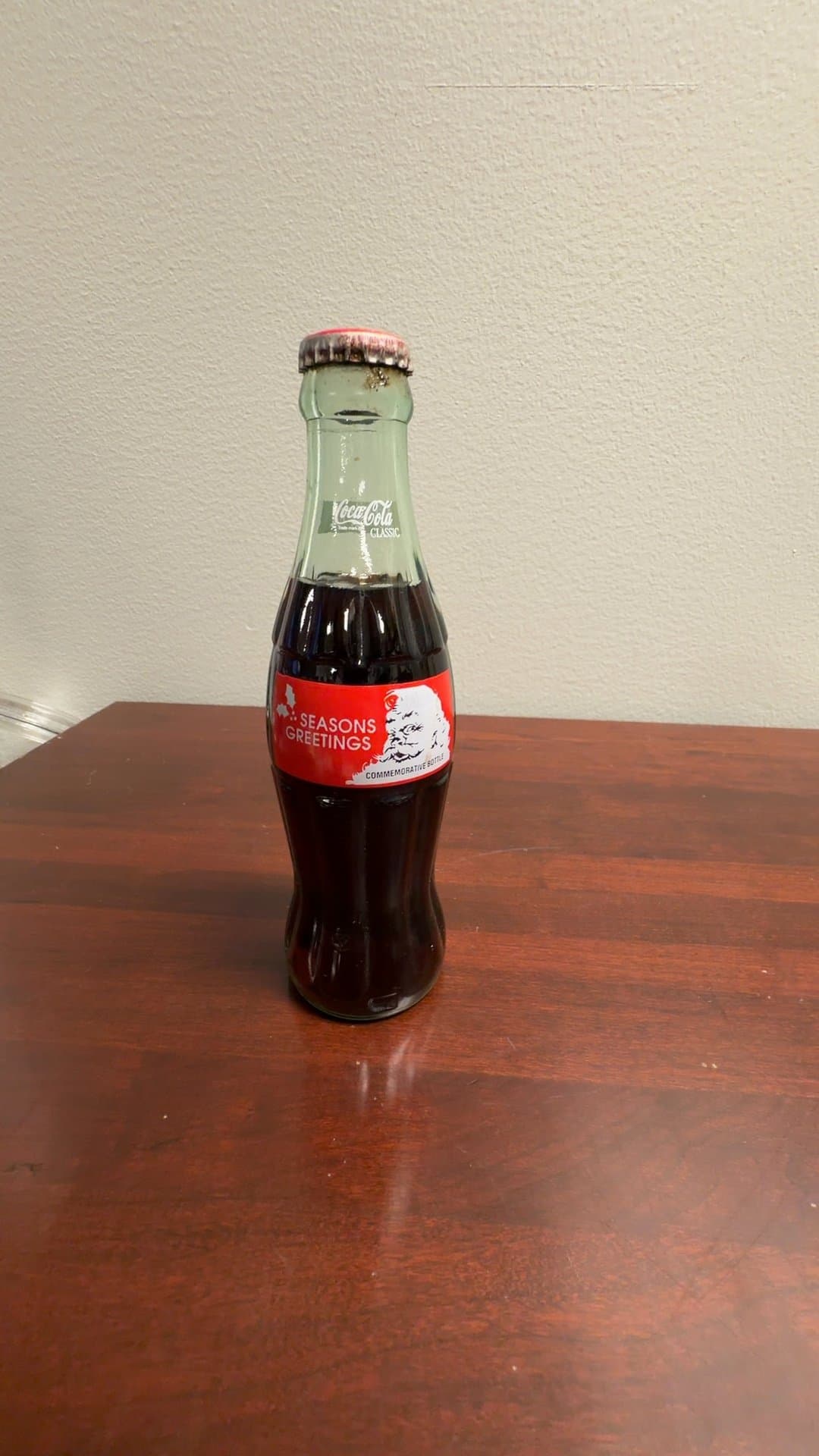 Coca-Cola Classic Seasons Greetings Commemorative Bottle - Image 1