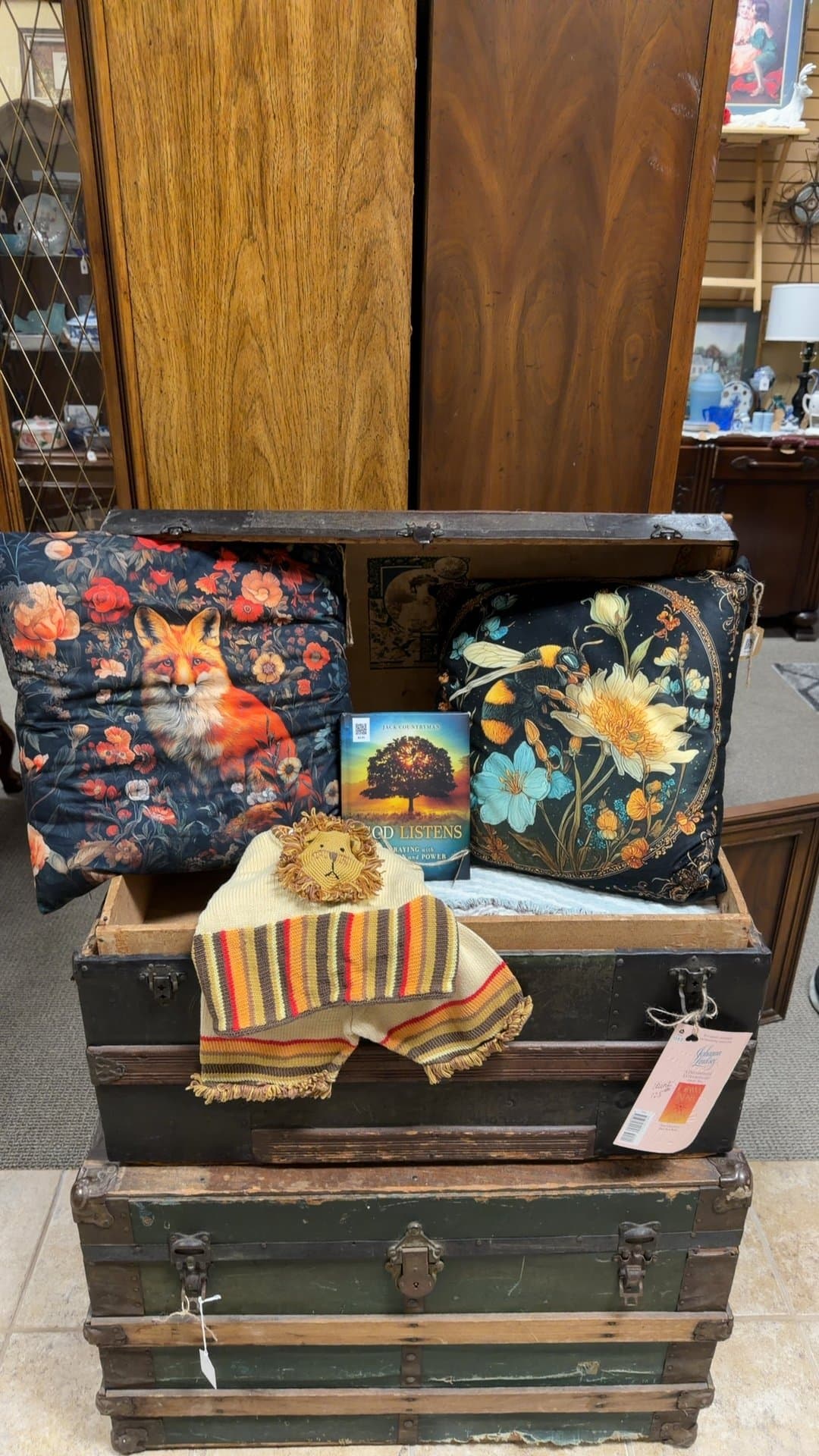 Vintage Wooden Trunk with Decorative Pillows and Book - Image 1