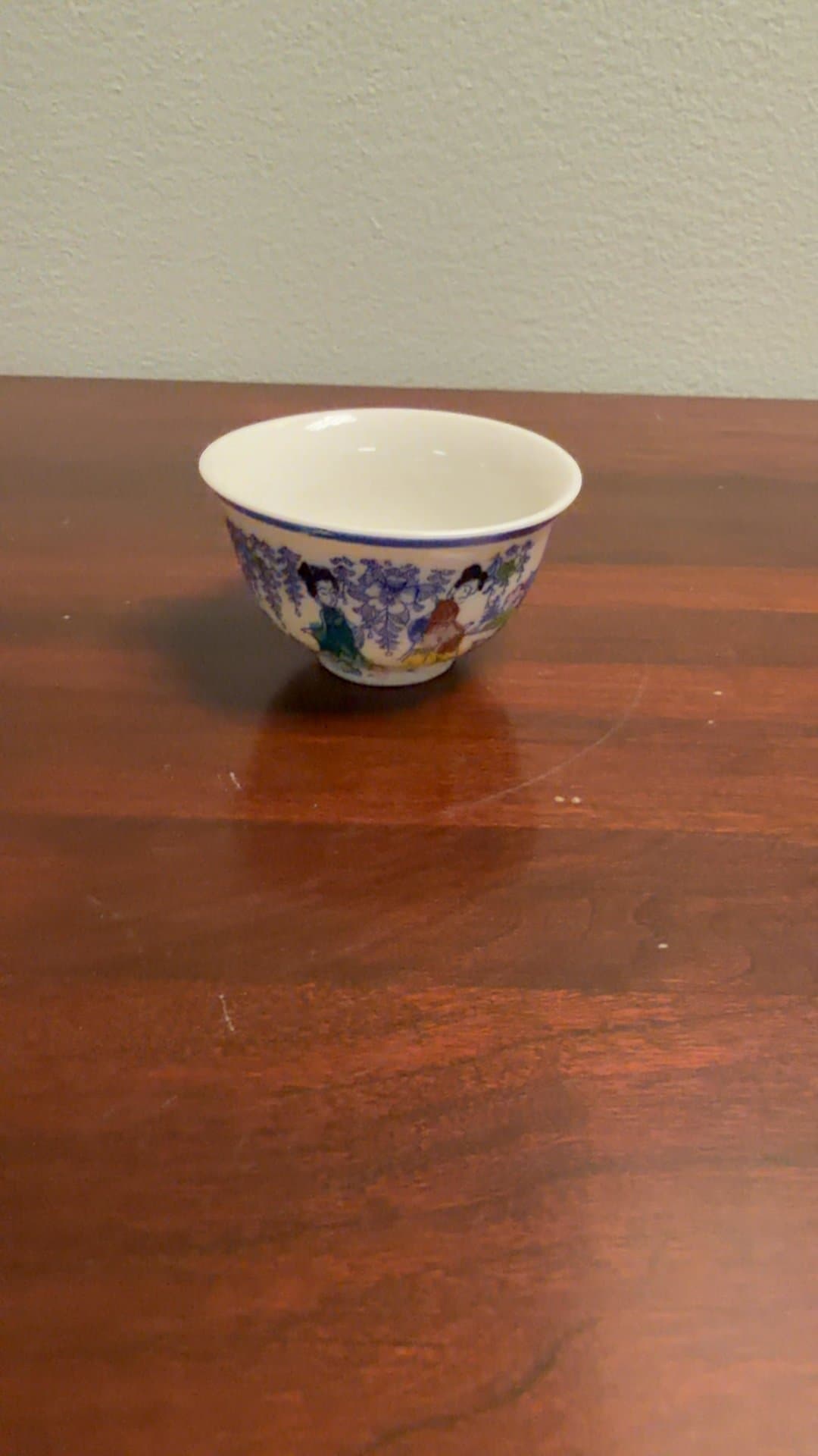 Blue and White Porcelain Bowl with Asian Motif - Image 1