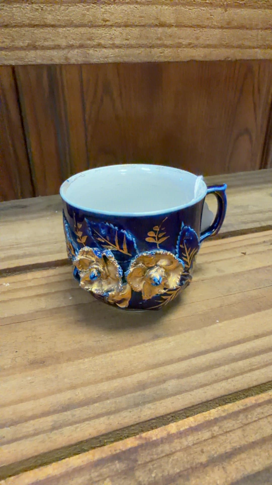 Vintage Blue Ceramic Coffee Cup with Floral Design - Image 1