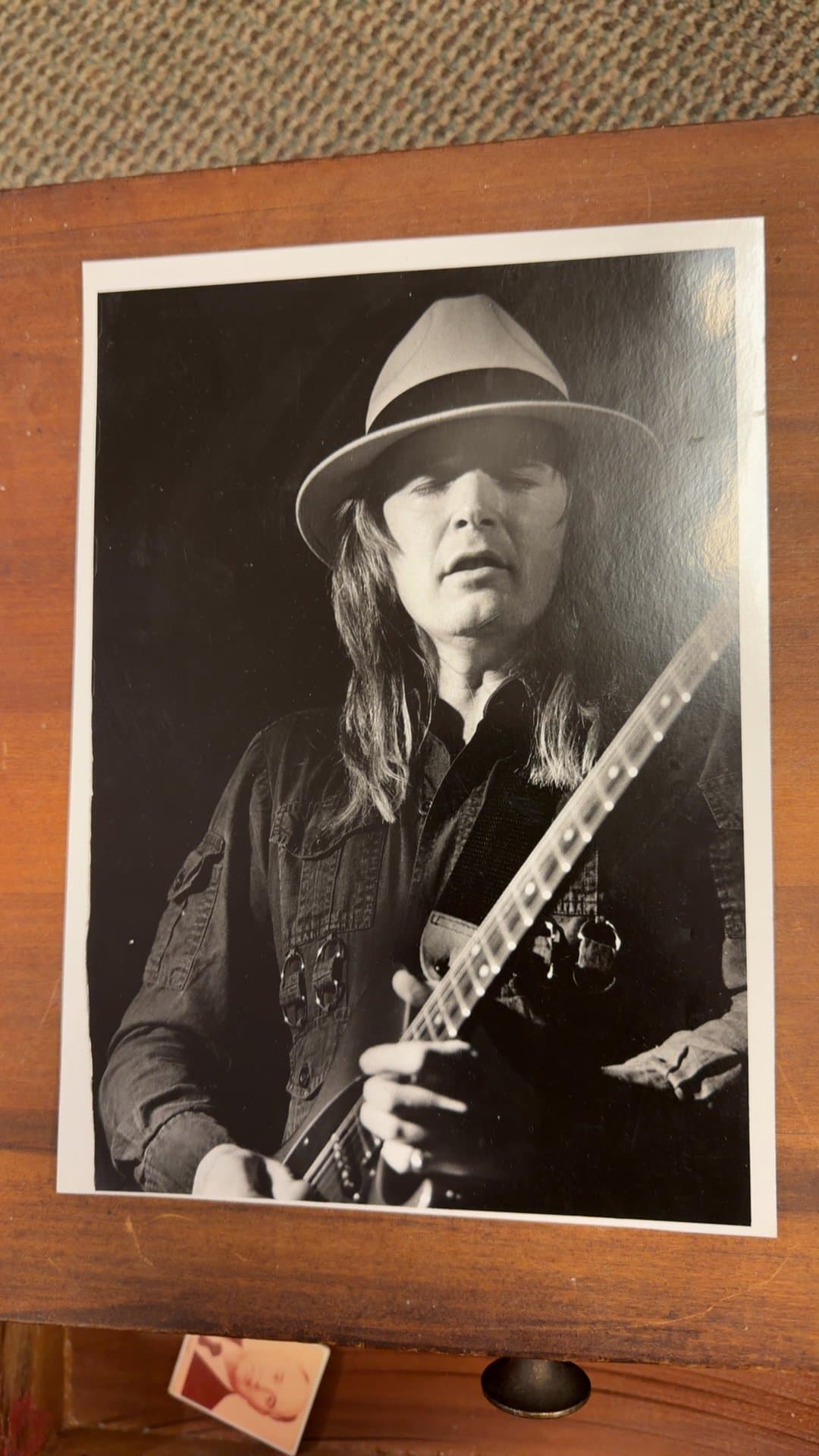 Monochrome Photograph of Musician with Guitar