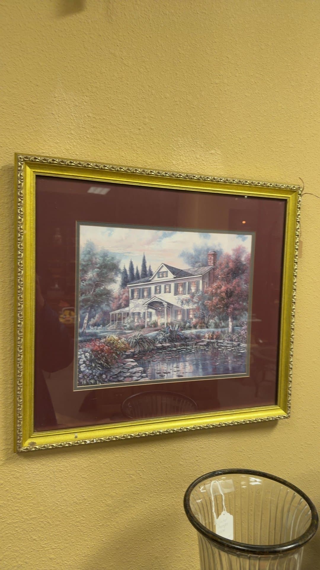 Framed Wall Print of a House by a Pond - Image 1