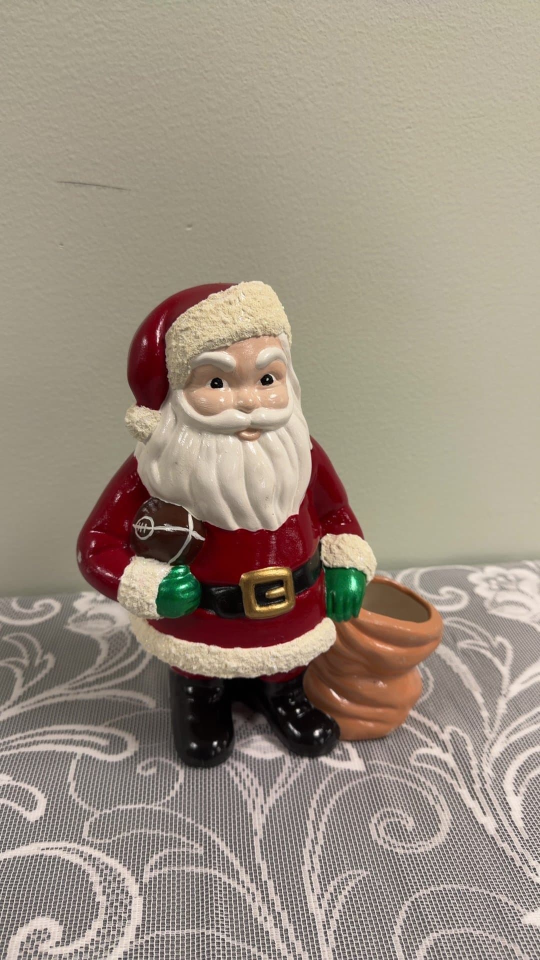 Ceramic Santa Claus Figurine Holding Football with Open Sack - Image 1