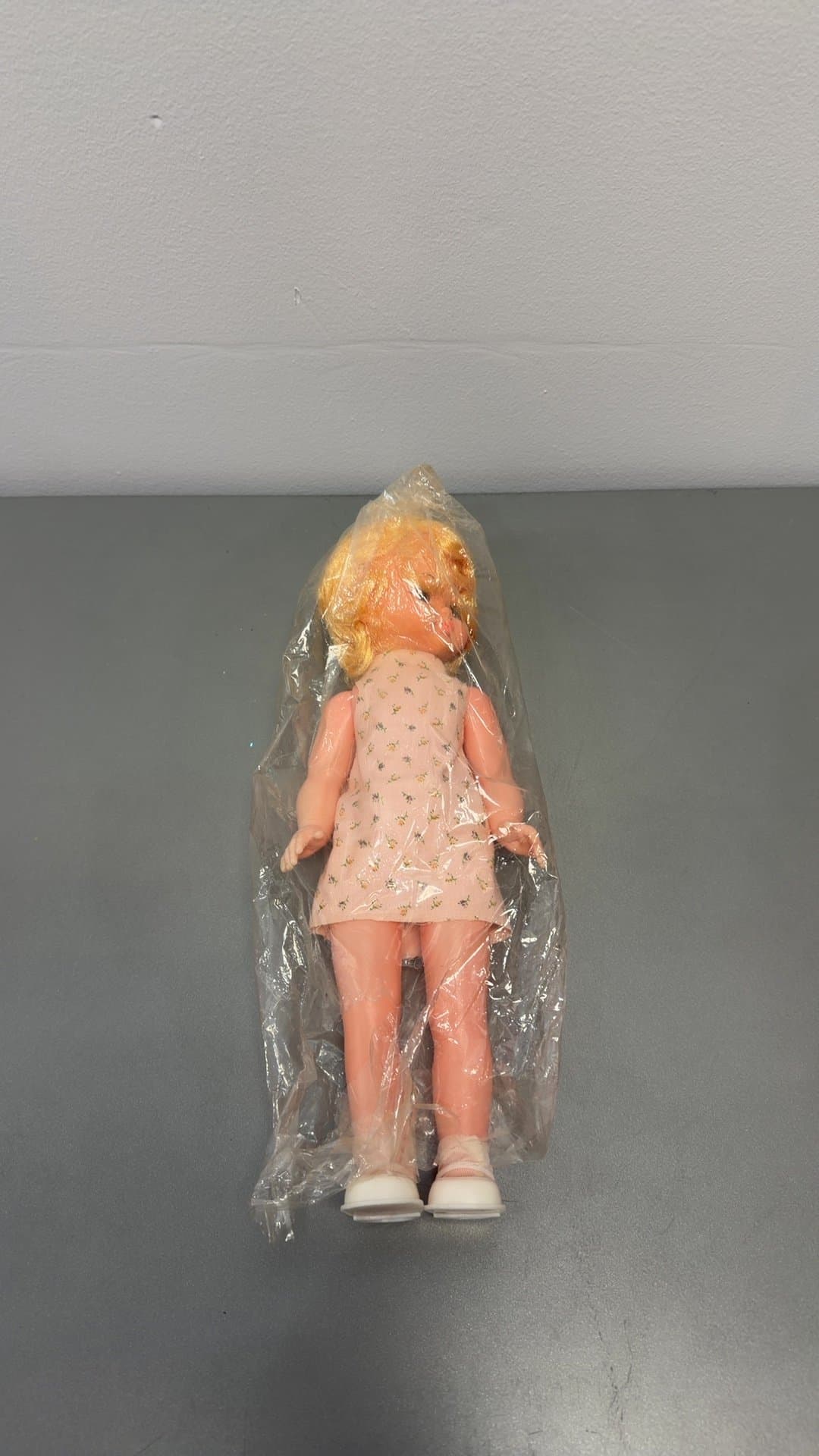 Vintage Blonde Plastic Doll in Floral Dress - Image 1