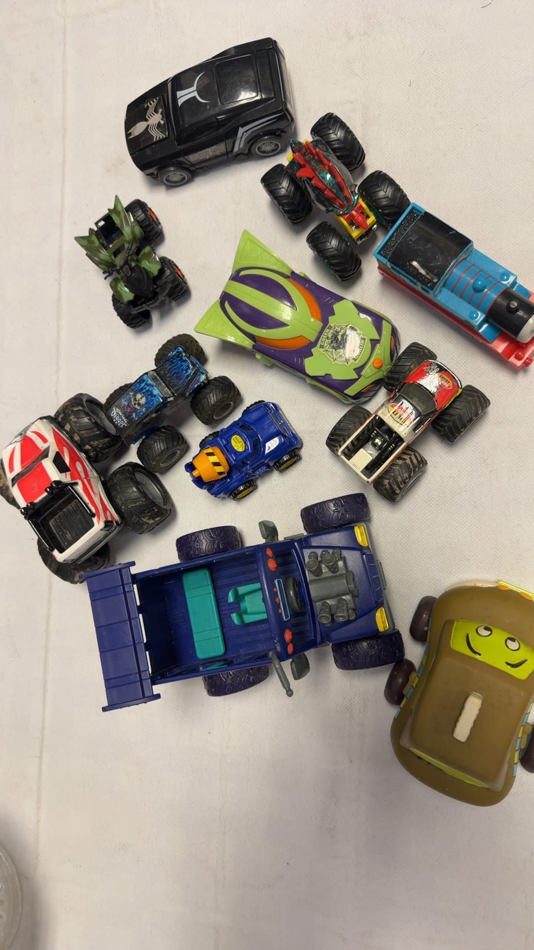 Assorted Toy Monster Trucks and Vehicle Lot - Image 1