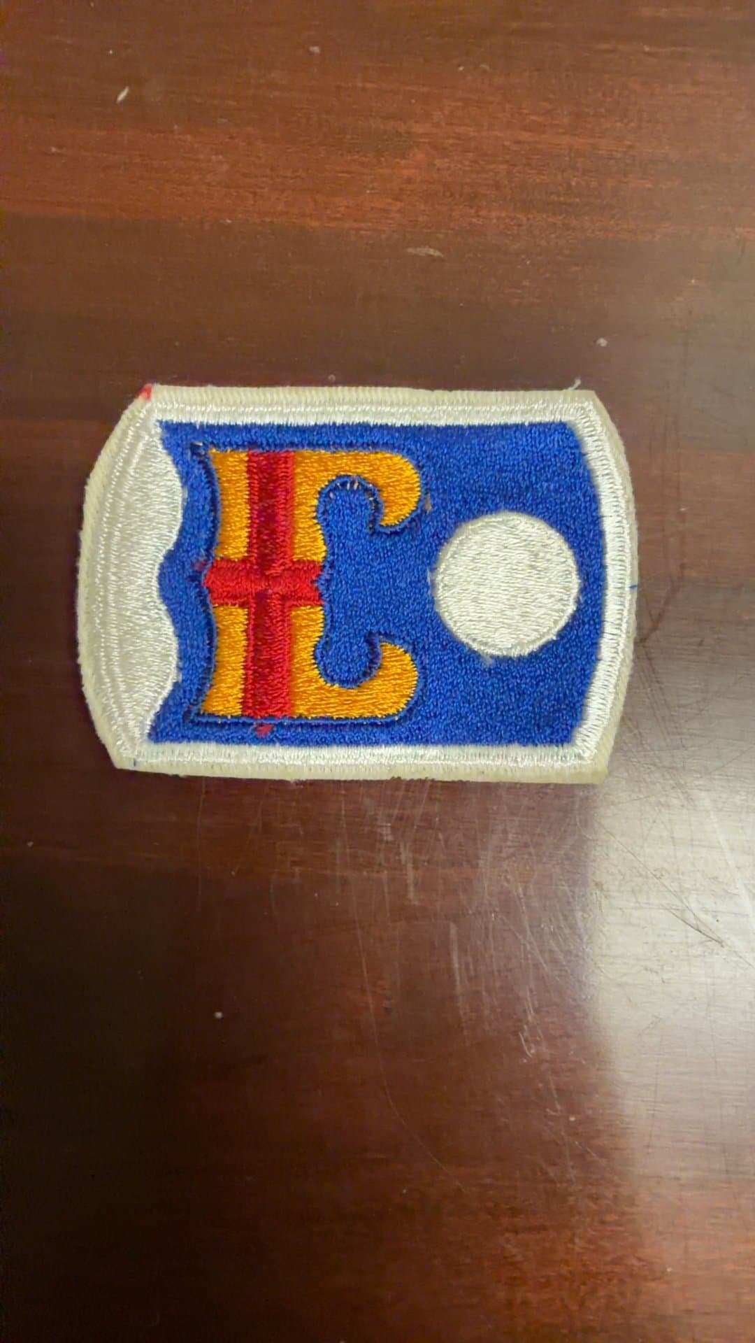 Embroidered Patch with Circle and Cross Design - Image 1