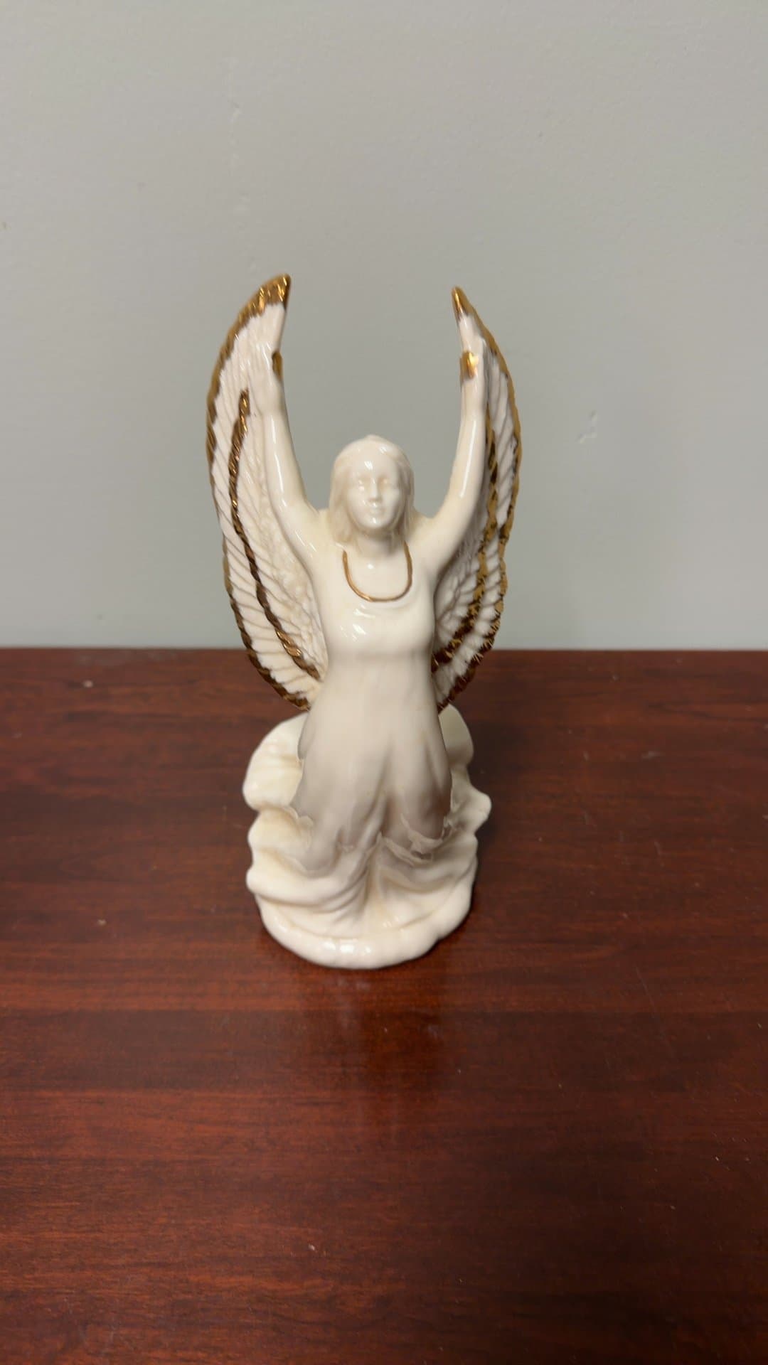 Porcelain Angel Figurine with Gold Accents - Image 1